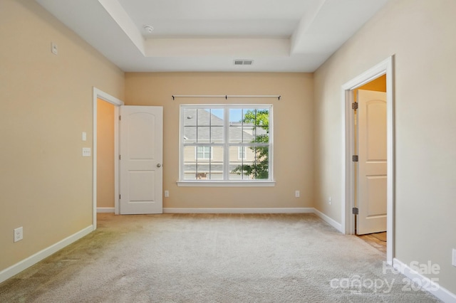 11209 Lazio Ln Unit 1, Charlotte, NC 28277 - carpeted spare room featuring a raised ceiling and baseboards