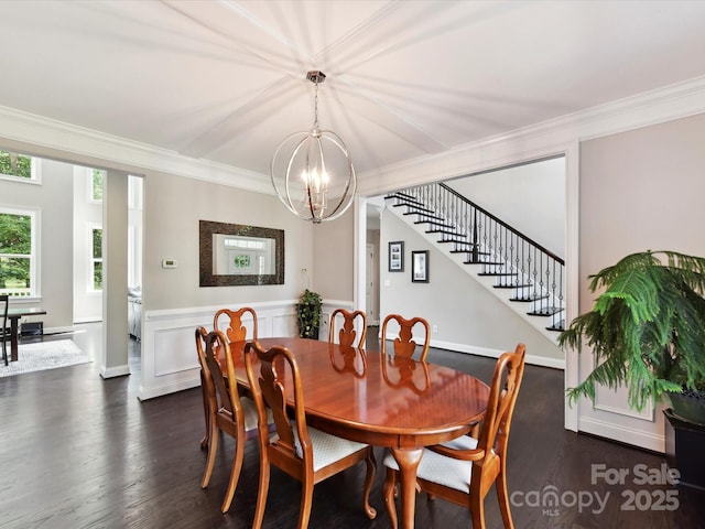 129 Overlook Ridge Ln, Davidson, NC 28036 - dining space with a chandelier, dark wood-style flooring, crown molding, stairway, and a wainscoted wall