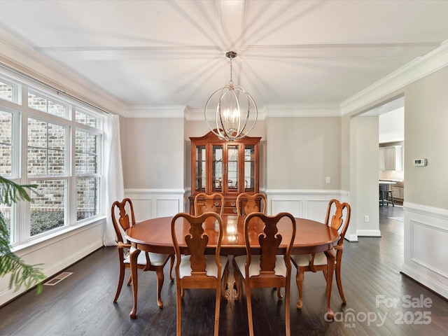 129 Overlook Ridge Ln, Davidson, NC 28036 - dining area featuring a chandelier, dark wood-style flooring, a wainscoted wall, and ornamental molding