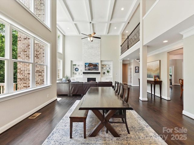 129 Overlook Ridge Ln, Davidson, NC 28036 - dining space with a stone fireplace, a high ceiling, ceiling fan, baseboards, and recessed lighting