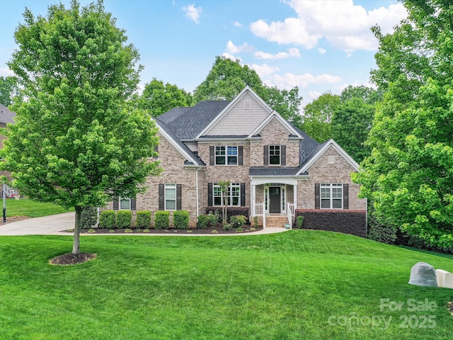 129 Overlook Ridge Ln, Davidson, NC 28036 - craftsman-style house with a front lawn and brick siding