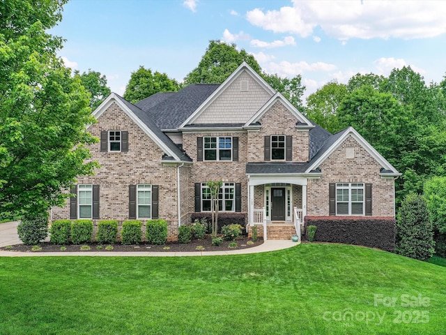 129 Overlook Ridge Ln, Davidson, NC 28036 - craftsman house featuring brick siding and a front yard