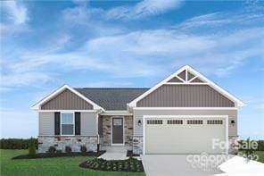 craftsman house with concrete driveway, a garage, a front lawn, and stone siding
