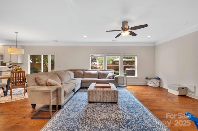 1225 Madison Green Dr, Fort Mill, SC 29715 - living room with healthy amount of natural light, wood finished floors, ceiling fan, recessed lighting, and baseboards