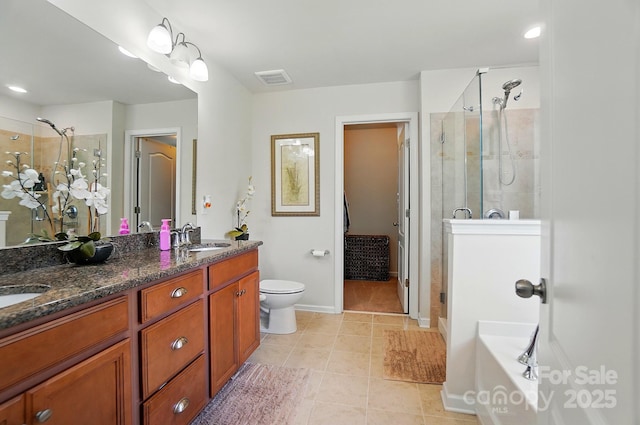 14316 Baytown Ct, Huntersville, NC 28078 - full bath featuring a shower stall, tile patterned floors, double vanity, baseboards, and toilet