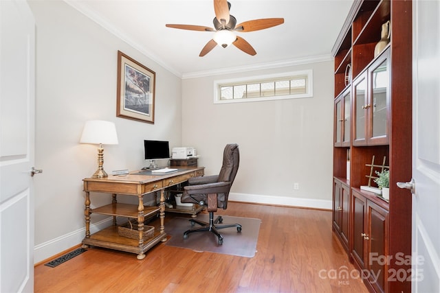 5214 Polo Gate Blvd, Charlotte, NC 28216 - home office with light wood-style floors, a ceiling fan, baseboards, and ornamental molding
