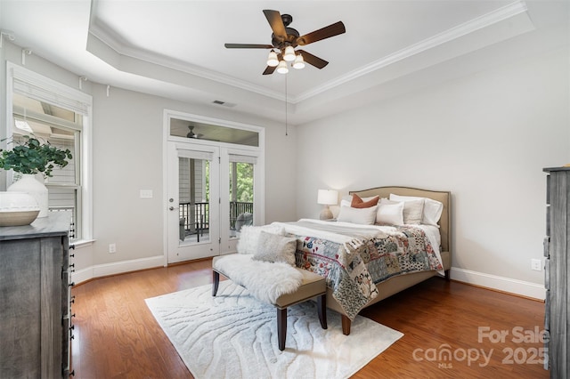 5214 Polo Gate Blvd, Charlotte, NC 28216 - bedroom featuring a raised ceiling, crown molding, access to exterior, and wood finished floors