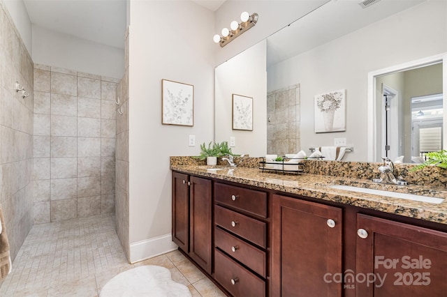 5214 Polo Gate Blvd, Charlotte, NC 28216 - full bathroom featuring double vanity, walk in shower, tile patterned floors, and baseboards