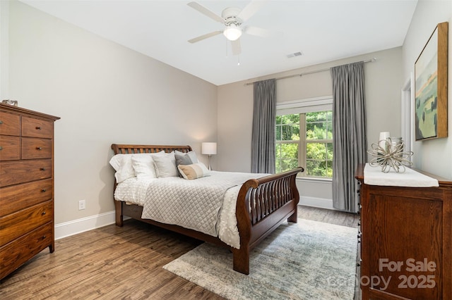 5214 Polo Gate Blvd, Charlotte, NC 28216 - bedroom featuring wood finished floors, baseboards, and ceiling fan