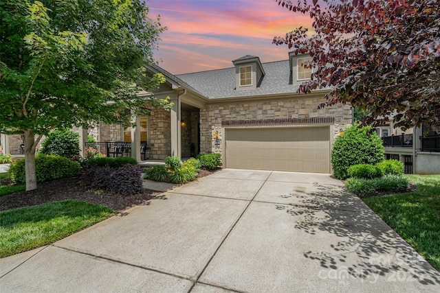 5214 Polo Gate Blvd, Charlotte, NC 28216 - view of front of house with stone siding, concrete driveway, a garage, and a shingled roof
