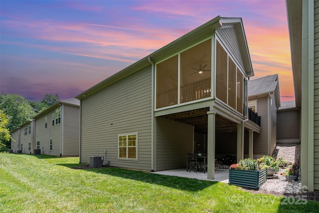 5214 Polo Gate Blvd, Charlotte, NC 28216 - rear view of property featuring a patio, central AC, a sunroom, and a lawn