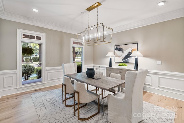 4920 Parview Dr S, Charlotte, NC 28226 - dining space featuring light wood-type flooring, wainscoting, recessed lighting, a chandelier, and crown molding