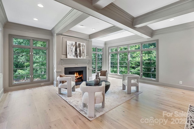4920 Parview Dr S, Charlotte, NC 28226 - living area featuring crown molding, a lit fireplace, beamed ceiling, wood finished floors, and healthy amount of natural light