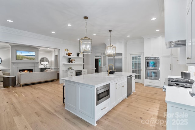 4920 Parview Dr S, Charlotte, NC 28226 - kitchen featuring built in appliances, a sink, ornamental molding, white cabinetry, and open floor plan