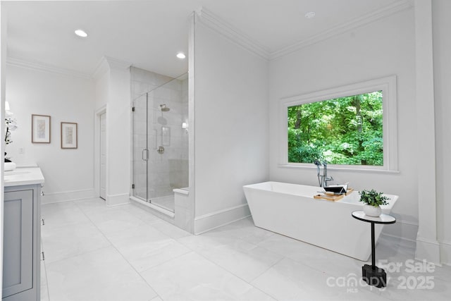 4920 Parview Dr S, Charlotte, NC 28226 - full bathroom with baseboards, a stall shower, crown molding, vanity, and a soaking tub