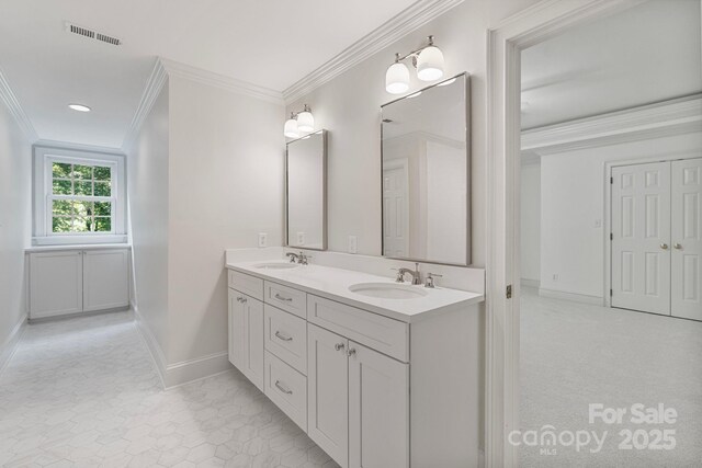 4920 Parview Dr S, Charlotte, NC 28226 - bathroom featuring double vanity, baseboards, and ornamental molding