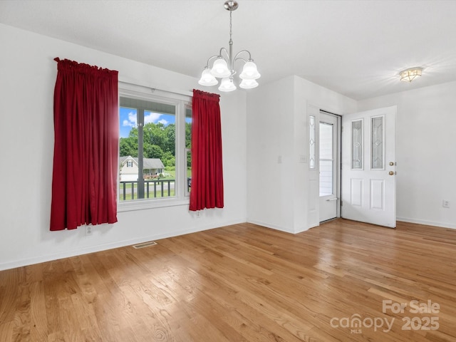 1028 Swaying Oats Dr, York, SC 29745 - empty room featuring a chandelier, light wood-type flooring, and baseboards