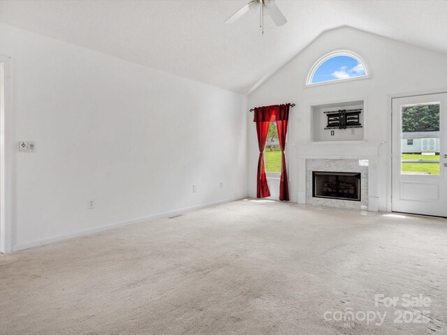 1028 Swaying Oats Dr, York, SC 29745 - unfurnished living room with a ceiling fan, carpet floors, vaulted ceiling, a premium fireplace, and baseboards