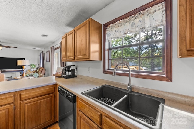 425 Troutman Rd, Rockwell, NC 28138 - kitchen with stainless steel dishwasher, a sink, light countertops, brown cabinets, and ceiling fan