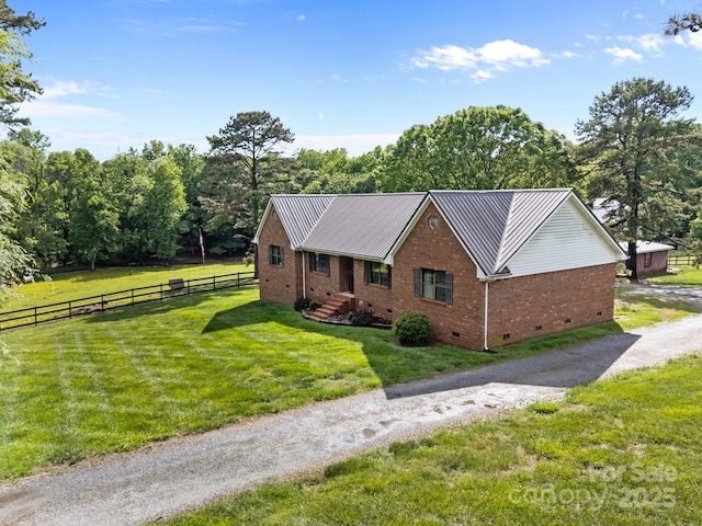 425 Troutman Rd, Rockwell, NC 28138 - view of front facade featuring crawl space, brick siding, and metal roof