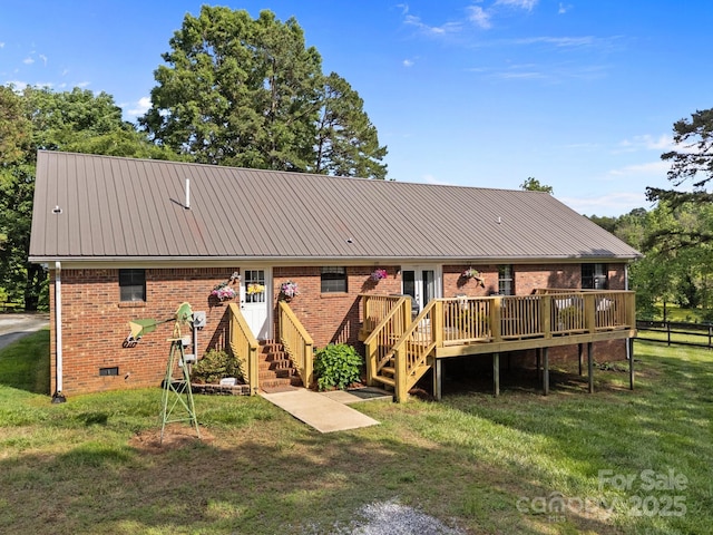 425 Troutman Rd, Rockwell, NC 28138 - back of property featuring a wooden deck, brick siding, a lawn, metal roof, and crawl space