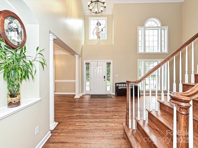 410 Deer Brush Ln, Waxhaw, NC 28173 - foyer entrance with plenty of natural light, wood finished floors, stairway, a towering ceiling, and baseboards