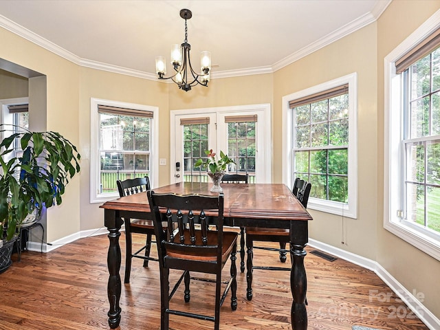 410 Deer Brush Ln, Waxhaw, NC 28173 - dining area with a chandelier, plenty of natural light, baseboards, wood finished floors, and ornamental molding