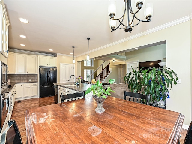 410 Deer Brush Ln, Waxhaw, NC 28173 - dining space featuring stairs, ornamental molding, a chandelier, dark wood-style floors, and recessed lighting