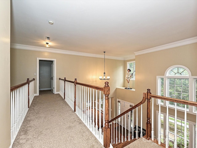 410 Deer Brush Ln, Waxhaw, NC 28173 - hall with an upstairs landing, carpet flooring, ornamental molding, a chandelier, and baseboards