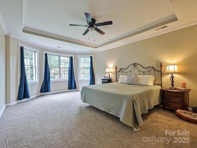 410 Deer Brush Ln, Waxhaw, NC 28173 - bedroom featuring a raised ceiling, carpet floors, ornamental molding, multiple windows, and baseboards