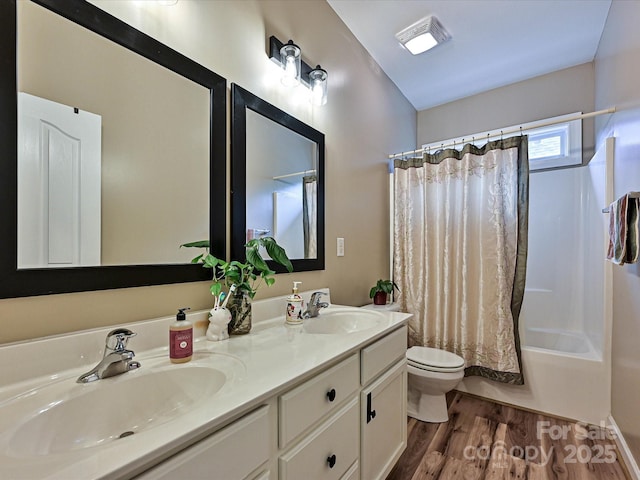 410 Deer Brush Ln, Waxhaw, NC 28173 - full bathroom featuring wood finished floors, toilet, double vanity, and shower / bathtub combination with curtain