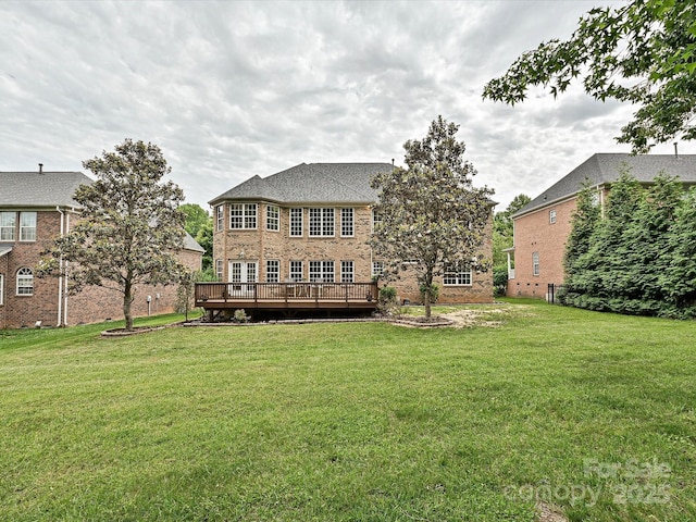 410 Deer Brush Ln, Waxhaw, NC 28173 - rear view of house featuring a deck, a yard, and brick siding