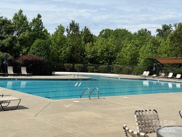 410 Deer Brush Ln, Waxhaw, NC 28173 - community pool featuring a patio