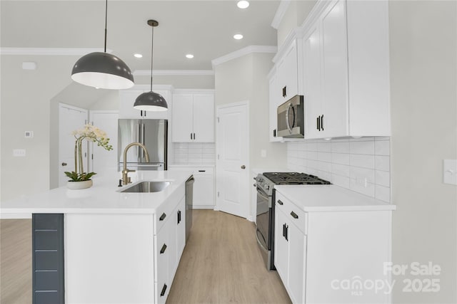 5946 Ardrey Kell Rd, Charlotte, NC 28277 - kitchen with stainless steel appliances, a sink, light wood-style flooring, decorative backsplash, and light countertops