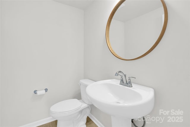 5946 Ardrey Kell Rd, Charlotte, NC 28277 - bathroom featuring a sink, baseboards, toilet, and wood finished floors