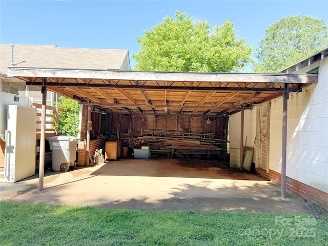view of parking / parking lot with a carport