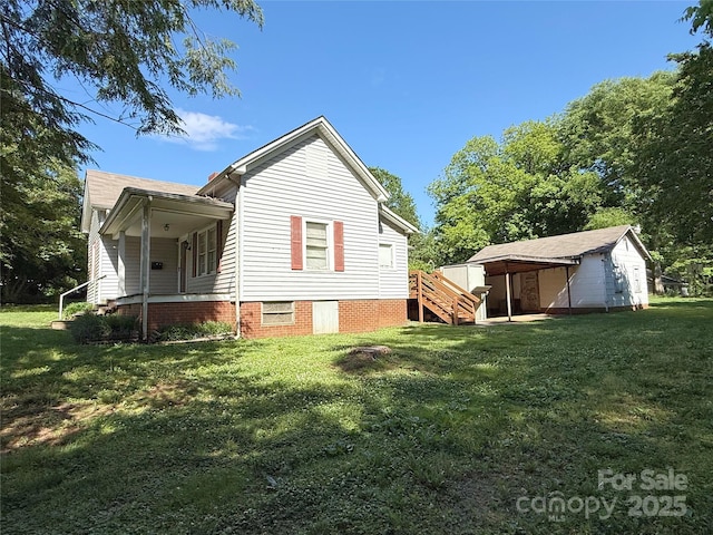 view of side of property with a yard