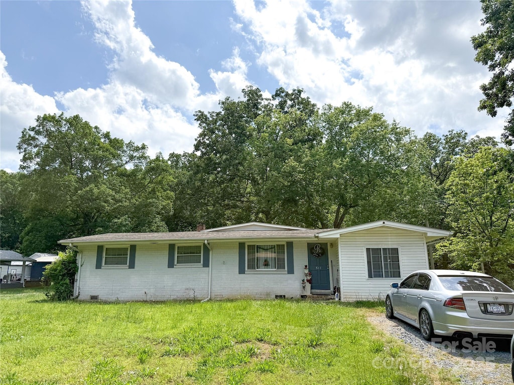 511 Eastwood Dr, Albemarle, NC 28001 - view of front of house featuring a front lawn, crawl space, and brick siding