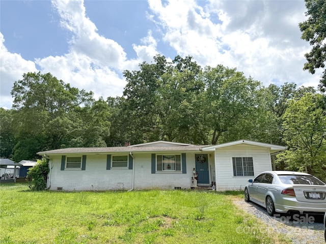 511 Eastwood Dr, Albemarle, NC 28001 - view of front of house featuring a front lawn, crawl space, and brick siding