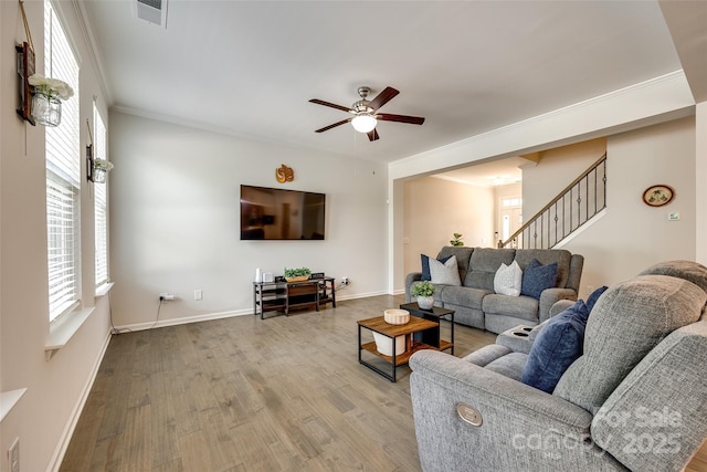 809 River Park Rd, Belmont, NC 28012 - living area featuring a ceiling fan, healthy amount of natural light, wood finished floors, stairway, and ornamental molding