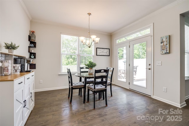 809 River Park Rd, Belmont, NC 28012 - dining space featuring plenty of natural light, dark wood-style flooring, crown molding, and a chandelier