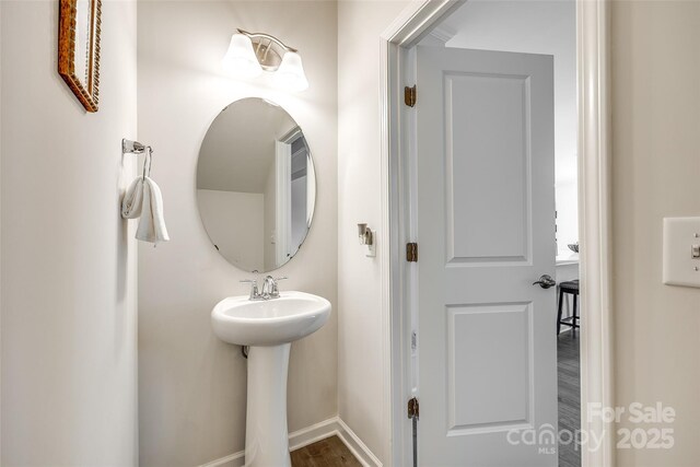 809 River Park Rd, Belmont, NC 28012 - bathroom with baseboards and wood finished floors