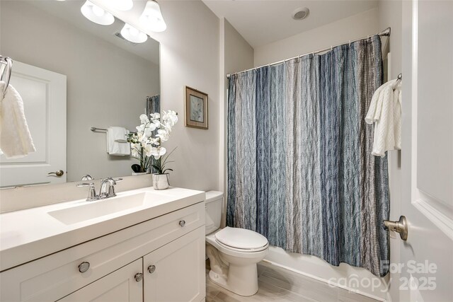 809 River Park Rd, Belmont, NC 28012 - full bath featuring toilet, vanity, shower / bath combo, and wood finished floors