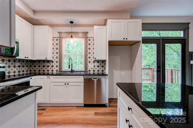 600 S Cline Ave, Newton, NC 28658 - kitchen with stainless steel appliances, a sink, white cabinets, light wood-style floors, and tasteful backsplash