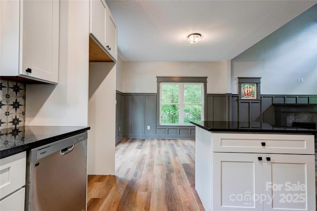 600 S Cline Ave, Newton, NC 28658 - kitchen featuring stainless steel dishwasher, light wood-type flooring, white cabinetry, dark stone countertops, and decorative backsplash