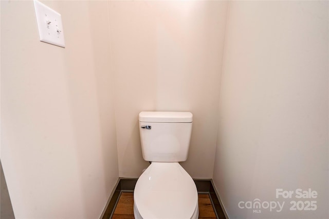 600 S Cline Ave, Newton, NC 28658 - bathroom featuring baseboards, toilet, and wood finished floors