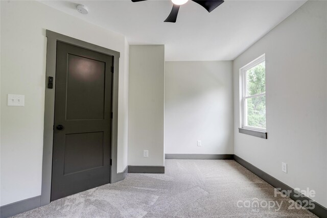600 S Cline Ave, Newton, NC 28658 - spare room with a smoke detector, carpet, a ceiling fan, and baseboards