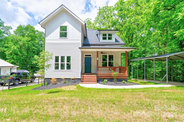 600 S Cline Ave, Newton, NC 28658 - view of front of home featuring a porch, a front yard, a ceiling fan, and board and batten siding