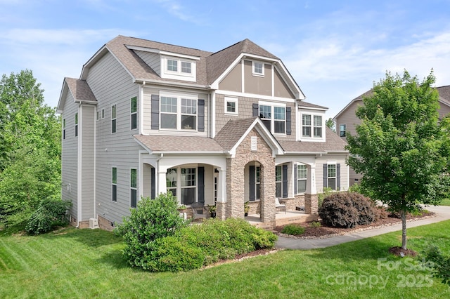 10911 Skymont Dr, Huntersville, NC 28078 - view of front of property with a porch, a front lawn, roof with shingles, and stone siding