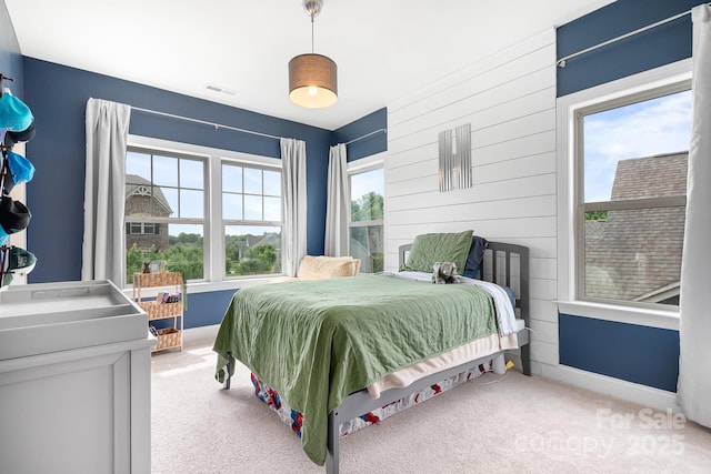 10911 Skymont Dr, Huntersville, NC 28078 - bedroom featuring light carpet, baseboards, and wood walls